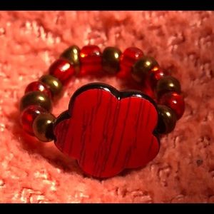 Homemade ring with a accented flower.